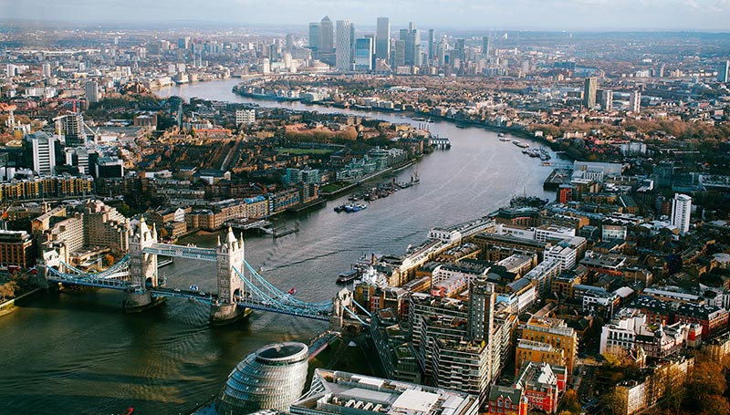 View from above of London Thames and Canary Wharf in the distance 